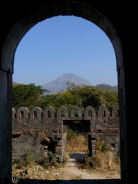 View of arch bridge against clear sky