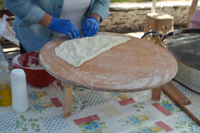 Close-up of man preparing food in kitchen