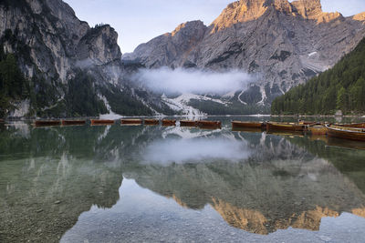 Scenic view of lake and mountains against sky