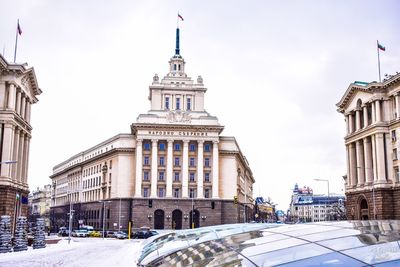 Buildings in city against sky