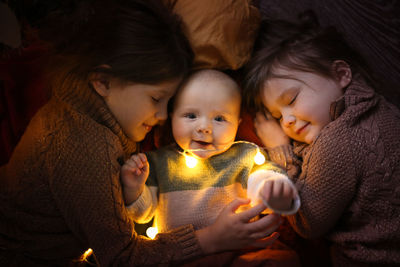 Funny children sleep together and embrace 