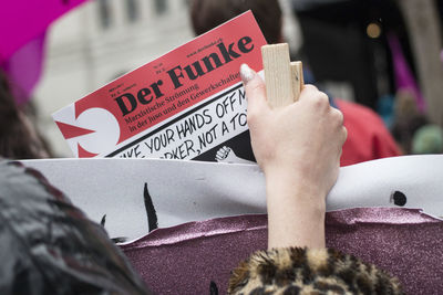 Close-up of text on hand