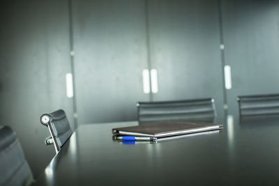 Close-up of illuminated electric lamp on table