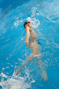 High angle view of man swimming in pool