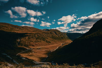 Scenic view of landscape and mountains against sky