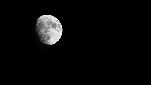 Scenic view of moon against clear sky at night