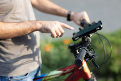 Midsection of man riding bicycle