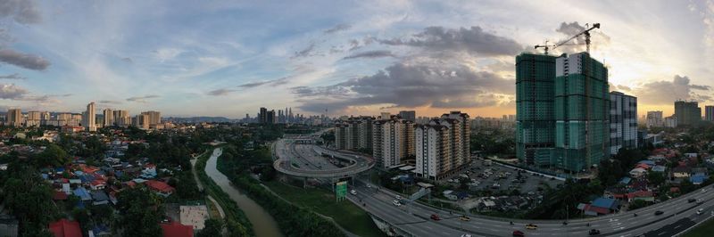 High angle view of city buildings against sky