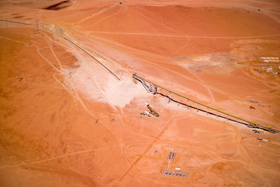 Aerial view of stock pile and conveyor belt at a copper mine in chile.