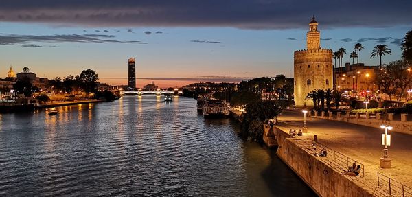 View of illuminated buildings at waterfront