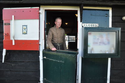 Portrait of man working at store