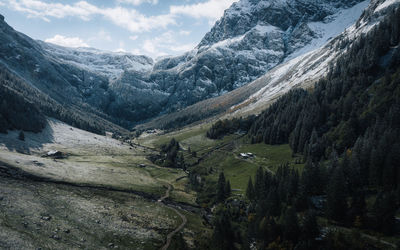 Scenic view of snowcapped mountains against sky