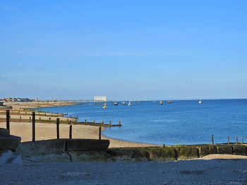 Scenic view of sea against blue sky