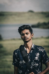 Portrait of young man standing outdoors