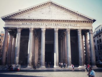 Group of people in front of historical building