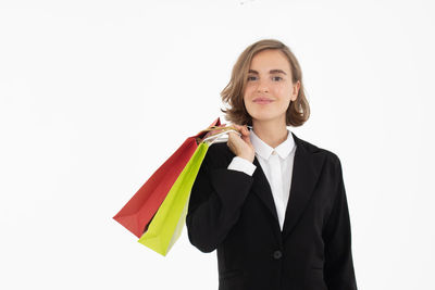 Portrait of a smiling young woman over white background