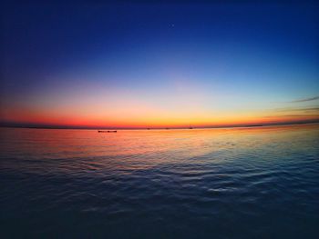 Scenic view of sea against clear sky during sunset