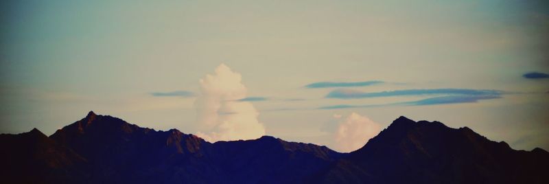 Scenic view of mountains against sky during sunset