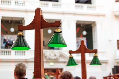 Low angle view of lighting equipment against building