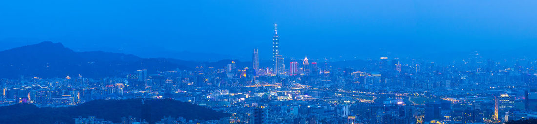 Panoramic view of city at night
