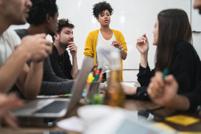 Businesswoman giving presentation in board room