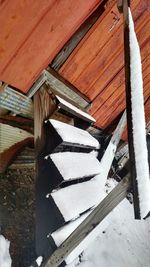 Low angle view of houses in snow covered house