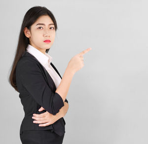 Portrait of a beautiful young woman over white background