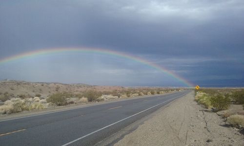 Rainbow over road