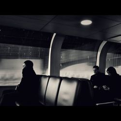 Rear view of people standing in bus