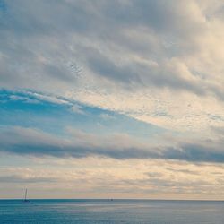 Scenic view of sea against cloudy sky