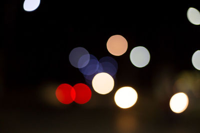 Defocused image of illuminated lights at night