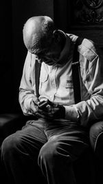 Man sitting on chair at home