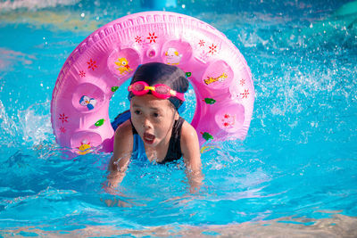 Children frolic at the water park. it is a sunny, perfect day for getting wet and playing hard.