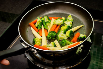 High angle view of chopped vegetables in cooking pan