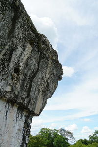 Low angle view of rock against sky