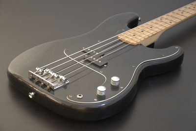 Close-up of guitar against black background