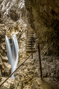 Low angle view of waterfall on rock formation