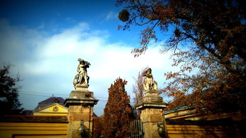 Low angle view of statue against sky