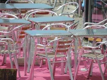 Close-up of chairs on table