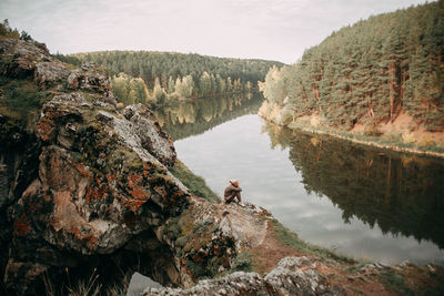 Rear view of man standing on rock