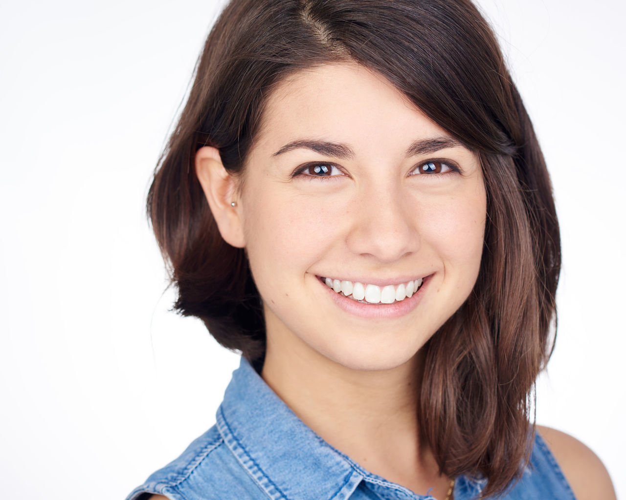 portrait, looking at camera, young adult, person, young women, front view, studio shot, headshot, lifestyles, long hair, white background, smiling, leisure activity, black hair, close-up, head and shoulders, casual clothing