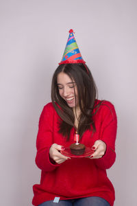 Portrait of woman holding red wine