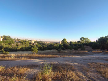 Scenic view of land against clear blue sky