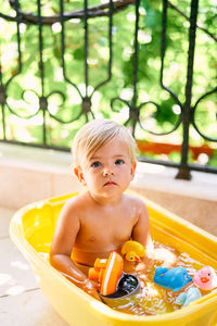 Portrait of cute baby girl with toy