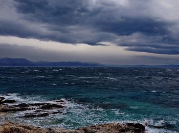 Scenic view of sea against cloudy sky