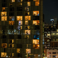 Illuminated buildings in city at night