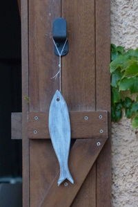 Close-up of hanging against door