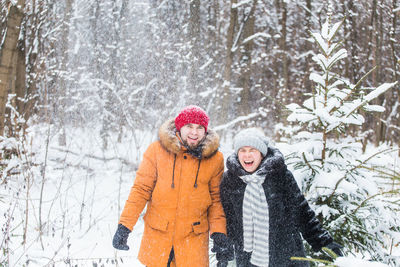 Portrait of a smiling woman in snow