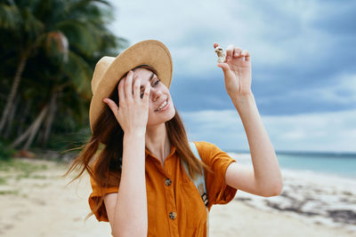 Low angle view of woman against sea