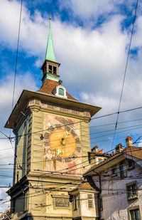 Low angle view of clock tower against sky